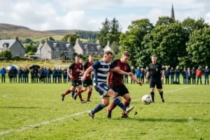 Players competing in an amateur football match at a Scottish grassroots football club.