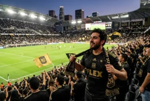 Supporter wearing an LAFC jersey at a football stadium