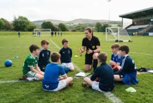 Football rules being explained to young players during a training session