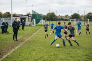 North East youth football players training and competing on a UK community football pitch